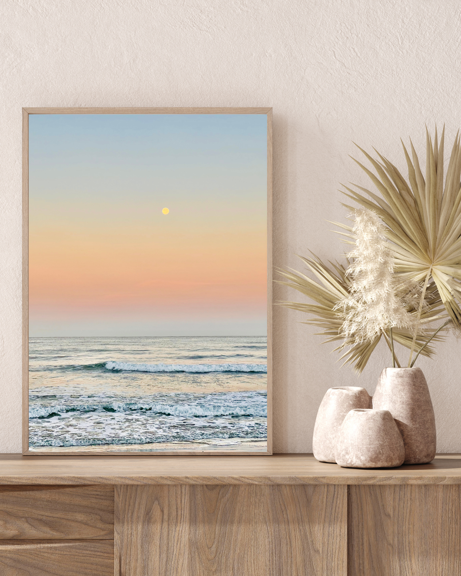 Bohemian neutral room decor with serene ocean sunrise print